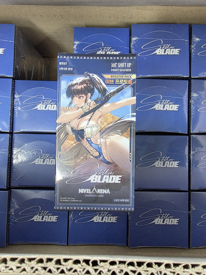 Sealed Nivel Arena Stella Blade booster boxes stacked on top of other boxes inside a cardboard box. The box feature game artwork of a female character , eve with long brown hair against a dark blue background.