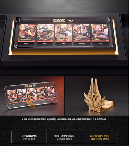 A framed collectible display set featuring five Battle Cat trading cards in a black acrylic case with gold trim, shown alongside a gold metal stand and product details on a dark background.